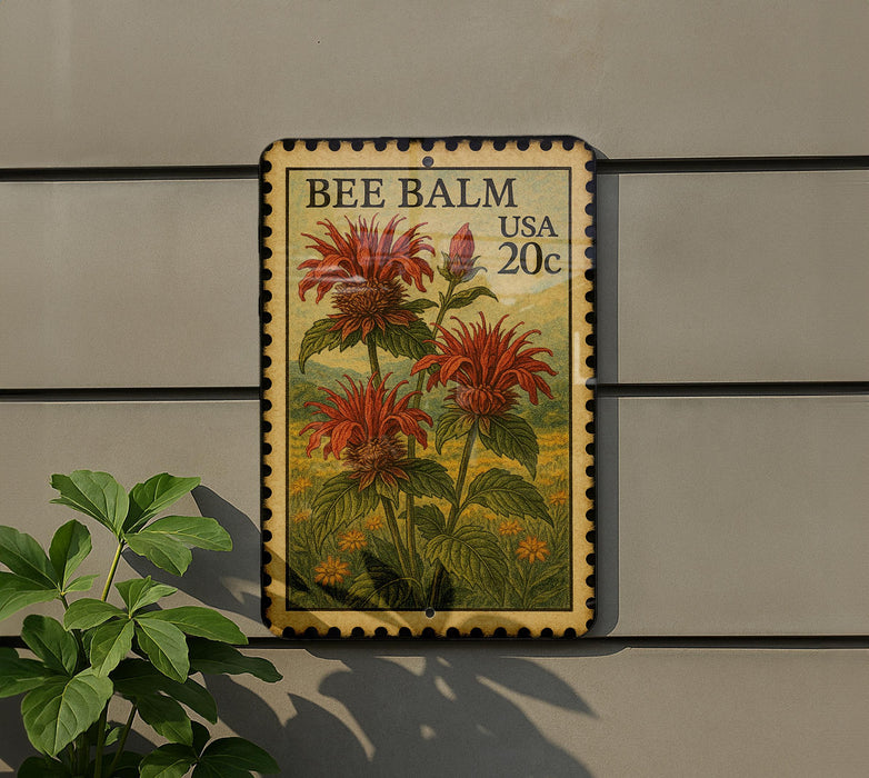 A vintage-style stamp depicting a red flower with green leaves, mounted on a wall next to a plant.