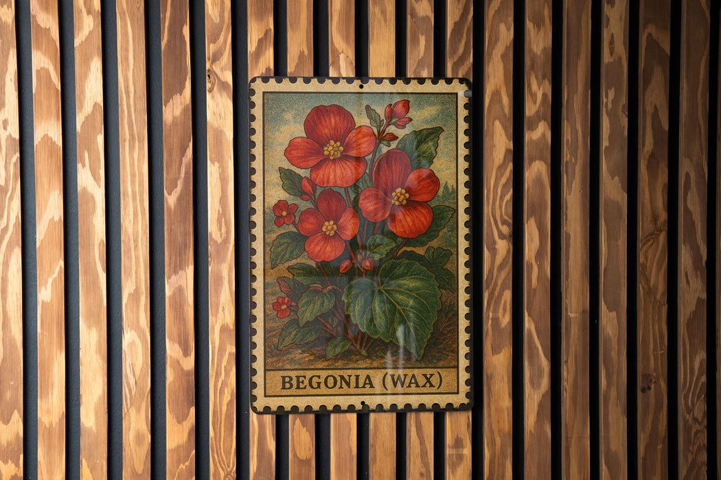 A vintage-style metal stamp featuring a vibrant illustration of red flowers against a wooden background.