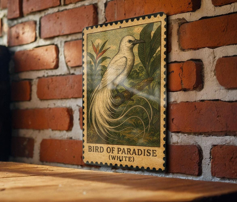 A framed illustration of a white bird with long tail feathers is displayed on a brick wall.