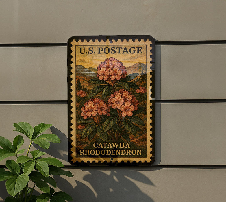A U.S. postage stamp featuring a floral design, mounted on a wall next to a plant.