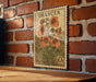 A vintage postage stamp featuring a floral design is displayed on a brick wall.