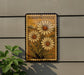 a decorative sign with a floral design, mounted on a wall next to a plant.