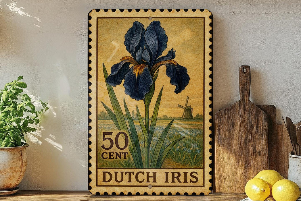 A framed postage stamp depicting a blue iris flower, with the text "50 CENT DUTCH IRIS" printed on it. The stamp is placed on a shelf next to a wooden cutting board and a potted plant.