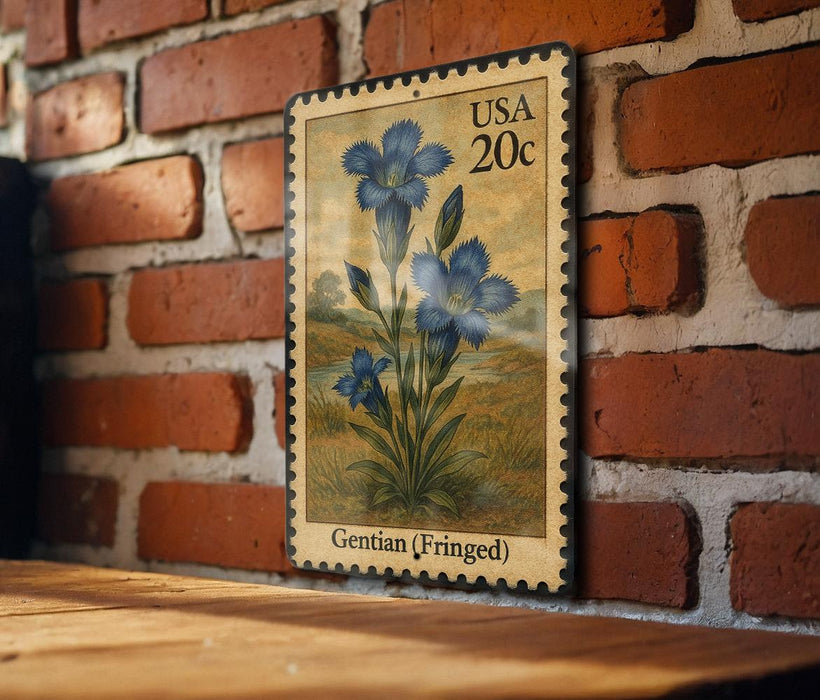 A framed postage stamp featuring a blue iris flower is displayed on a brick wall.