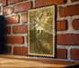 a vintage-style stamp with a floral design, mounted on a brick wall.