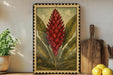 a framed illustration of a red flower with green leaves, placed on a shelf next to a wooden cutting board and a potted plant.