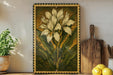 a framed painting of a white flower with green leaves, placed on a shelf next to a wooden cutting board and a potted plant.