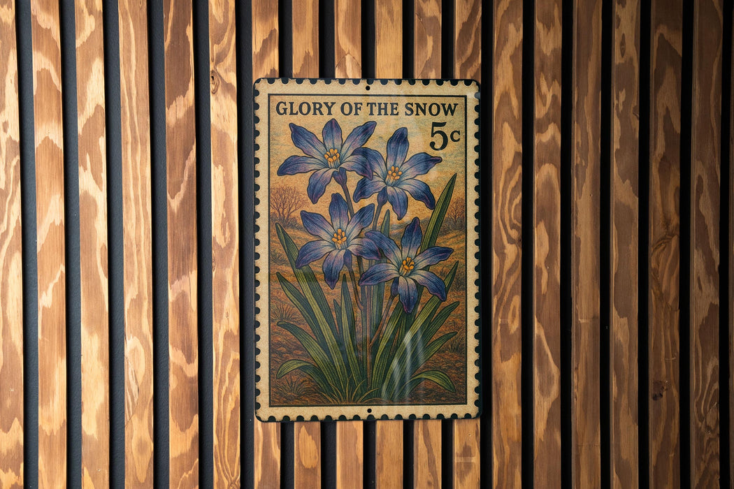 A vintage postage stamp featuring a floral design is displayed on a wooden wall.