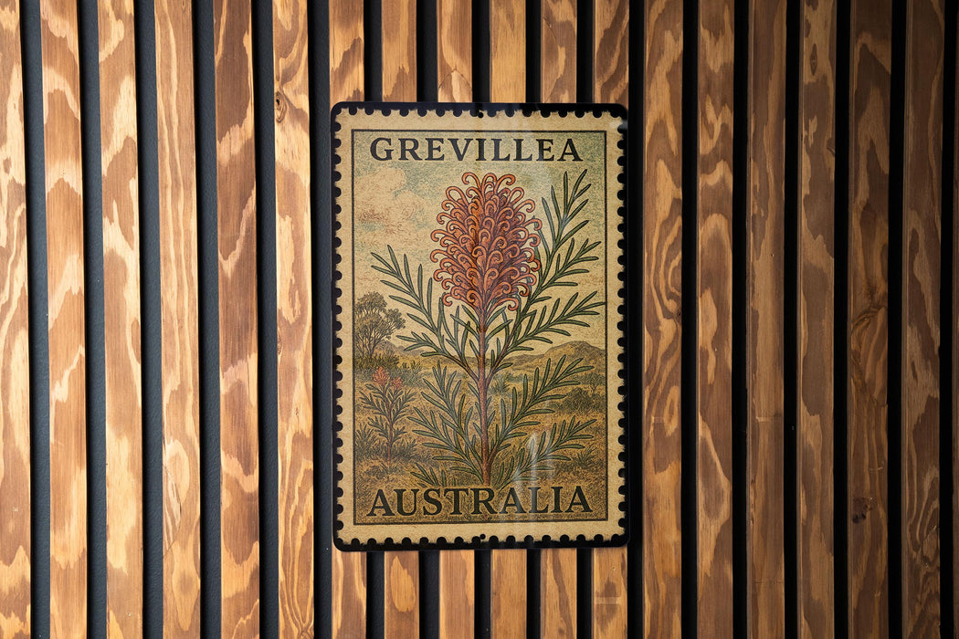 A postage stamp from Australia featuring a large pink flower against a wood background.