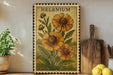 A framed illustration of a sunflower is displayed on a shelf, accompanied by a wooden cutting board, a potted plant, and a lemon.