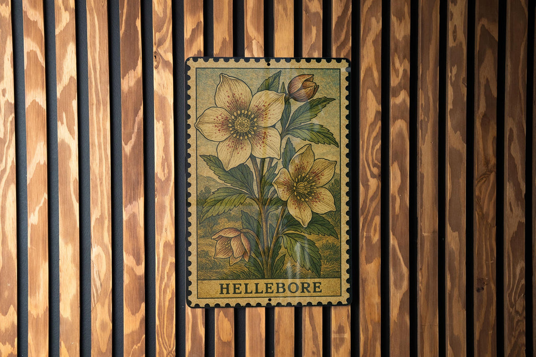 A metal stamp with a floral design is hanging on a wooden wall.