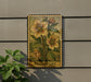 A framed illustration of a flower is hanging on a wall, with the word "Hellbore" written below it.