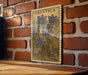 A vintage-style stamp featuring a floral illustration is displayed on a brick wall, with a wooden table below it.