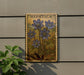 a wooden plaque with a floral design, mounted on a wall next to a plant.