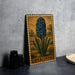 a framed illustration of a blue hyacinth flower on a wooden frame, placed on a table next to some black camera lenses.
