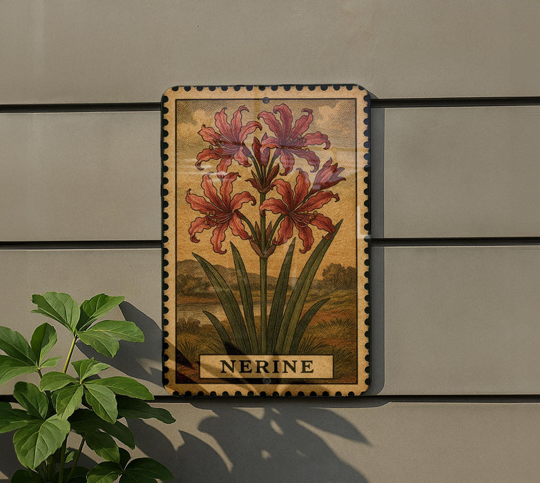 a decorative metal plaque with a floral illustration of red lilies, mounted on a wall next to a plant.