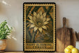 a framed illustration of a cactus flower, with the text "NIGHT-BLOOMING CEREUS" below it. The frame is placed on a shelf next to a wooden cutting board and a potted plant.