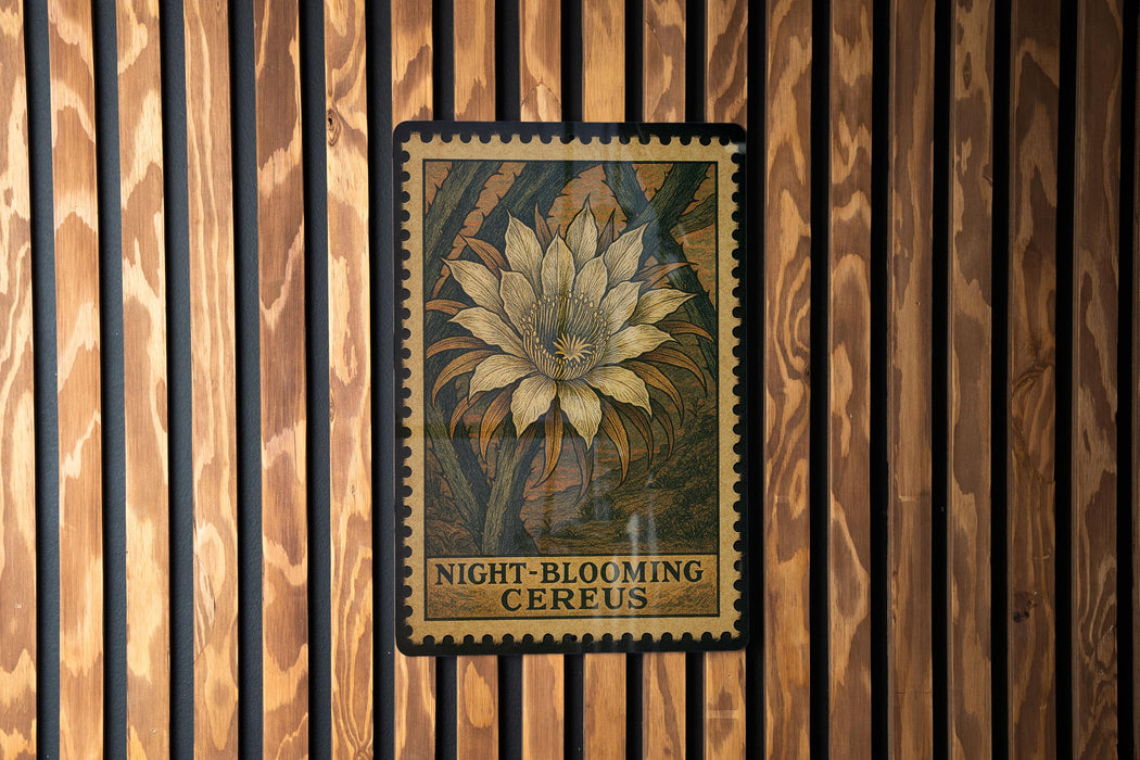 a large, detailed illustration of a night-blooming cereus flower on a wooden wall.