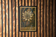 a large, detailed illustration of a night-blooming cereus flower on a wooden wall.