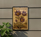 a decorative sign with a floral design, mounted on a wall next to a plant.
