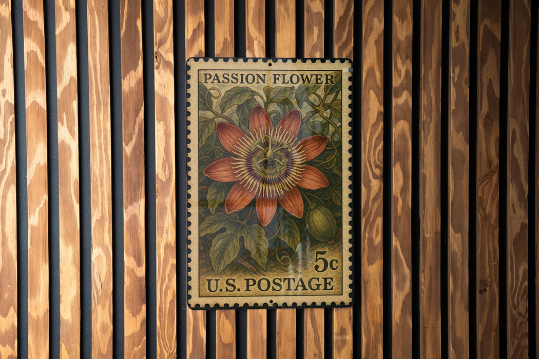 A vintage U.S. postage stamp featuring a vibrant illustration of a passion flower, mounted on a wooden wall.