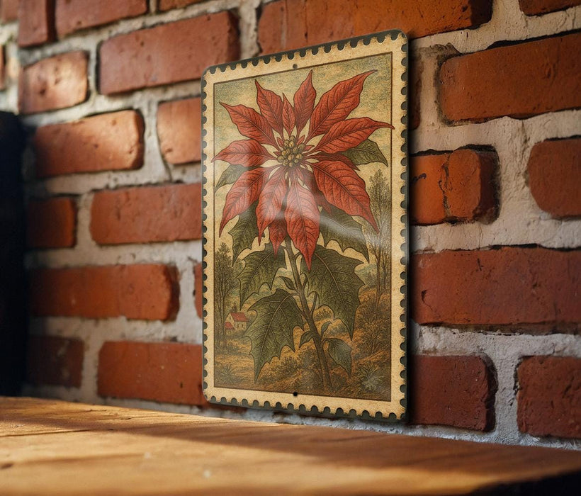a wooden table with a framed illustration of a red flower, possibly a poinsettia, hanging on a brick wall.