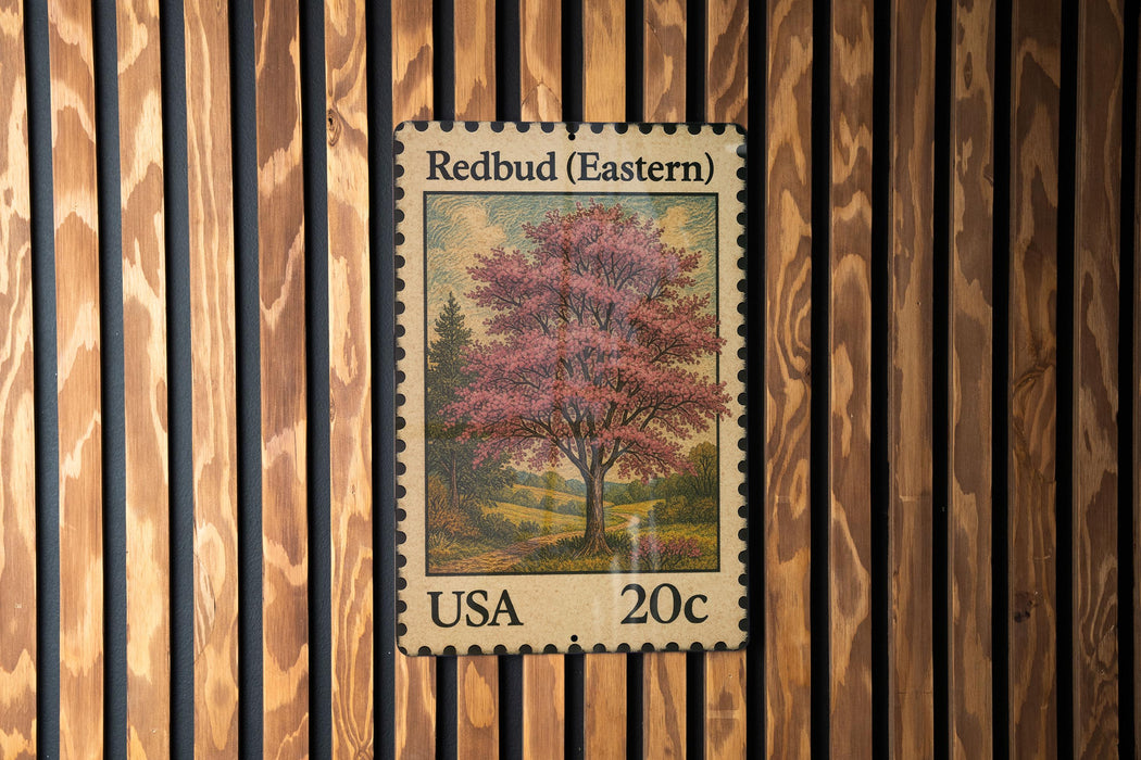 A United States postage stamp featuring a redbud tree, which is a type of flowering tree native to eastern North America.