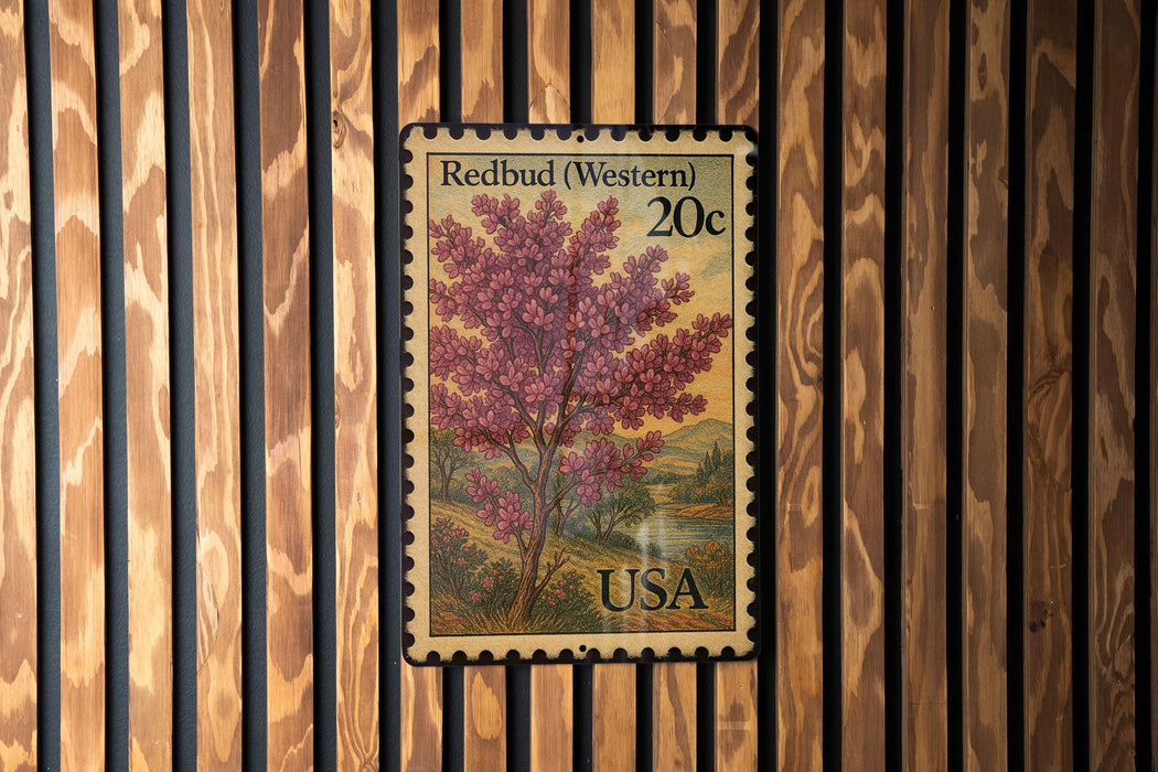A 20c United States postage stamp featuring a redbud tree, which is a type of flowering shrub, against a wooden background.