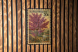 A 20c United States postage stamp featuring a redbud tree, which is a type of flowering shrub, against a wooden background.