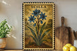 a framed illustration of blue flowers on a shelf, with a wooden cutting board and a potted plant nearby.