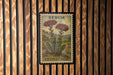 A framed image of a Sedum stonecrop plant is displayed on a wooden wall.