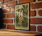 A 20c postage stamp featuring a depiction of a green plant with yellow flowers, mounted on a brick wall.