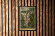 A 20c postage stamp featuring a close-up of a plant with yellow flowers, hanging on a wooden wall.