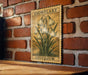A vintage-style stamp depicting snowflakes is hanging on a brick wall, with a wooden table below it.