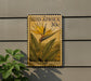 A postage stamp featuring a yellow flower and green leaves, with the text "SUID-AFRIKA 30c STREITLITZIA (MANDELA'S GOLD)" printed on it.
