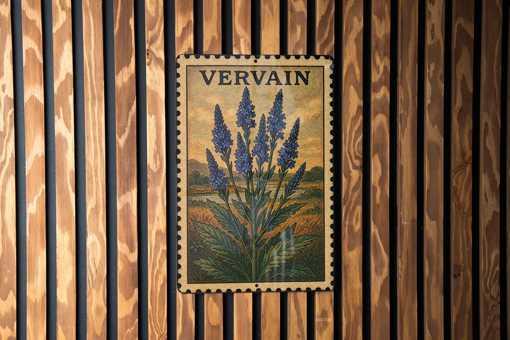a framed illustration of blue flowers on a wooden wall.