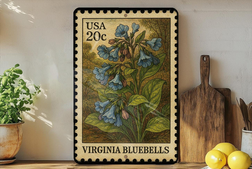 A framed vintage postage stamp from Virginia, featuring a detailed illustration of bluebell flowers, is displayed on a shelf next to a wooden cutting board and a potted plant.
