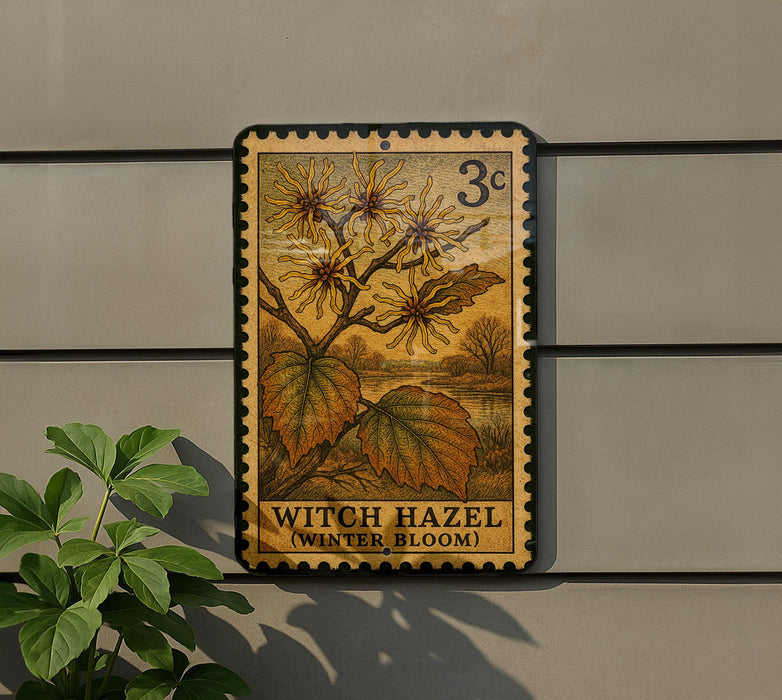 A vintage-style postage stamp featuring a plant with yellow flowers and green leaves, mounted on a wall next to a plant.