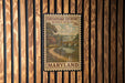 A framed postage stamp from Maryland, depicting a scenic countryside landscape with a river and bridge.