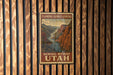 A framed vintage postage stamp depicting a scenic view of Flaming Gorge-Uintas, with the text "Scenic Byway Utah" printed on it.