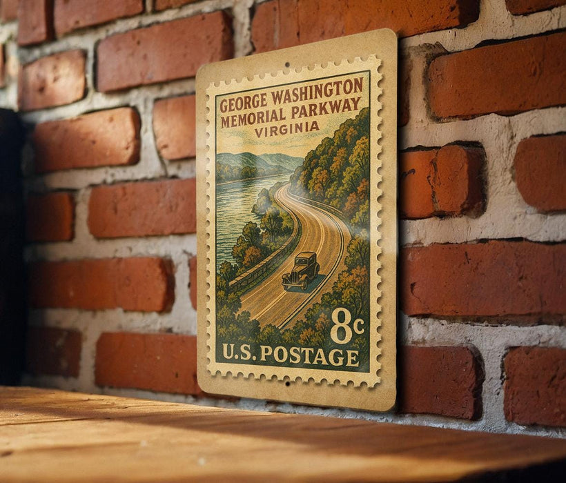 A vintage postage stamp from the United States, featuring a scenic road winding through a mountainous landscape with a river running alongside.
