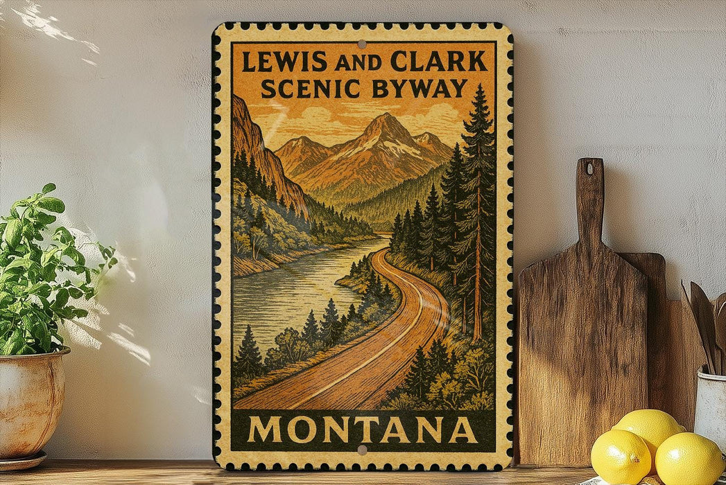 A framed vintage-style sign depicting a scenic mountain landscape with a winding road, surrounded by pine trees and mountains, with the text "LEWIS AND CLARK SCENIC BYWAY" and "MISSOURI" printed on it.