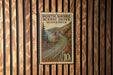 A vintage U.S. postage stamp from North Shore Scenic Drive, Minnesota, featuring a scenic road surrounded by autumn foliage.