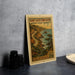 A vintage-style metal sign depicting the San Luis Obispo North Coast Byway in California, with a scenic illustration of a winding road and coastal landscape.