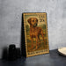 A metal sign featuring a brown dog standing in a field, with a stamp on it.