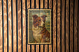 A vintage-style Border Collie postage stamp is displayed on a wooden wall.