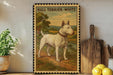 a bull terrier painted on a wooden frame, standing on a dirt path in a rural setting.