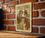 a framed illustration of a Cavalier King Charles Spaniel dog on a brick wall.