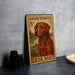A metal sign featuring a Labrador Retriever dog, with a postage stamp design, is displayed on a table.