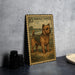 A framed illustration of a Norfolk Terrier dog is displayed on a wall, with a stamp-like border.